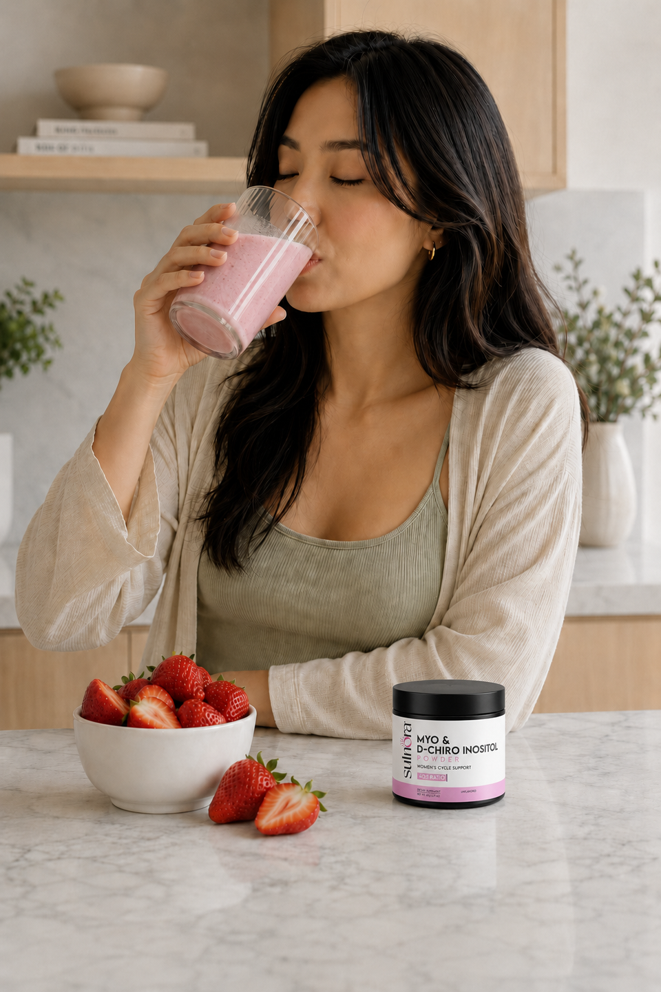 Woman enjoying a beverage with Sulnora nearby